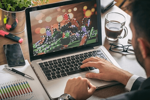 Best Online Casino Reviews Photo of Player on Laptop Gambling